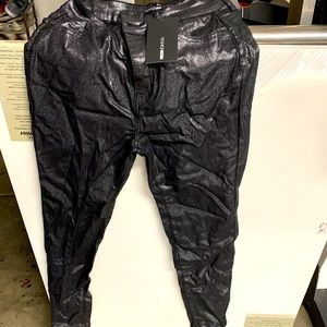 Black sparkly pants. Stretchy.